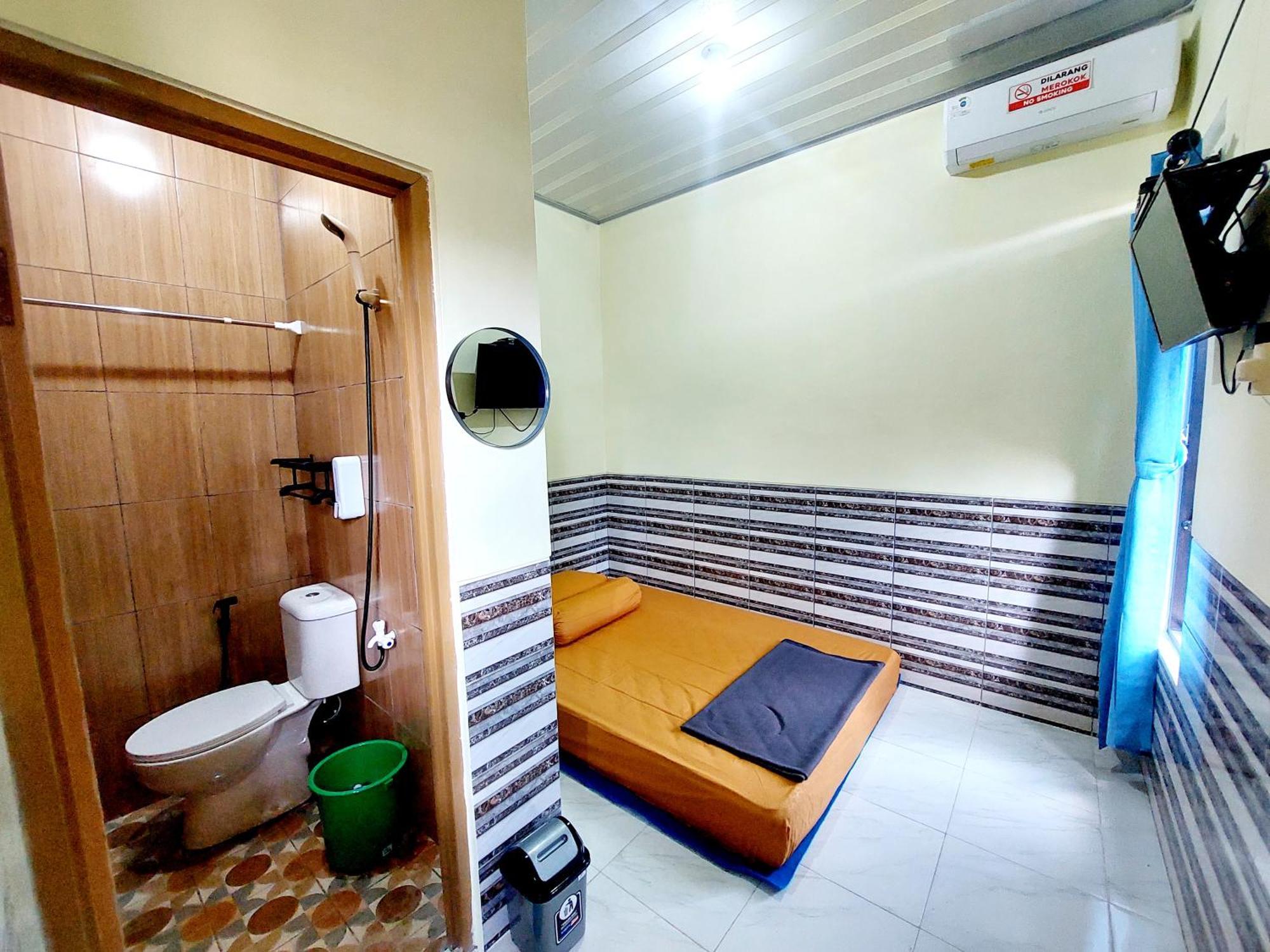Griya Tugu Jogja Syariah Hotell Yogyakarta Rum bild